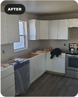 Manitowoc kitchen after renovation with brighter cabinetry and flooring.